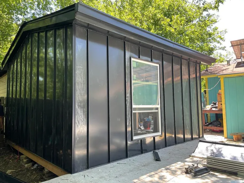 Black standing seam metal wall panels for Metal Roof Installation in Maquoketa